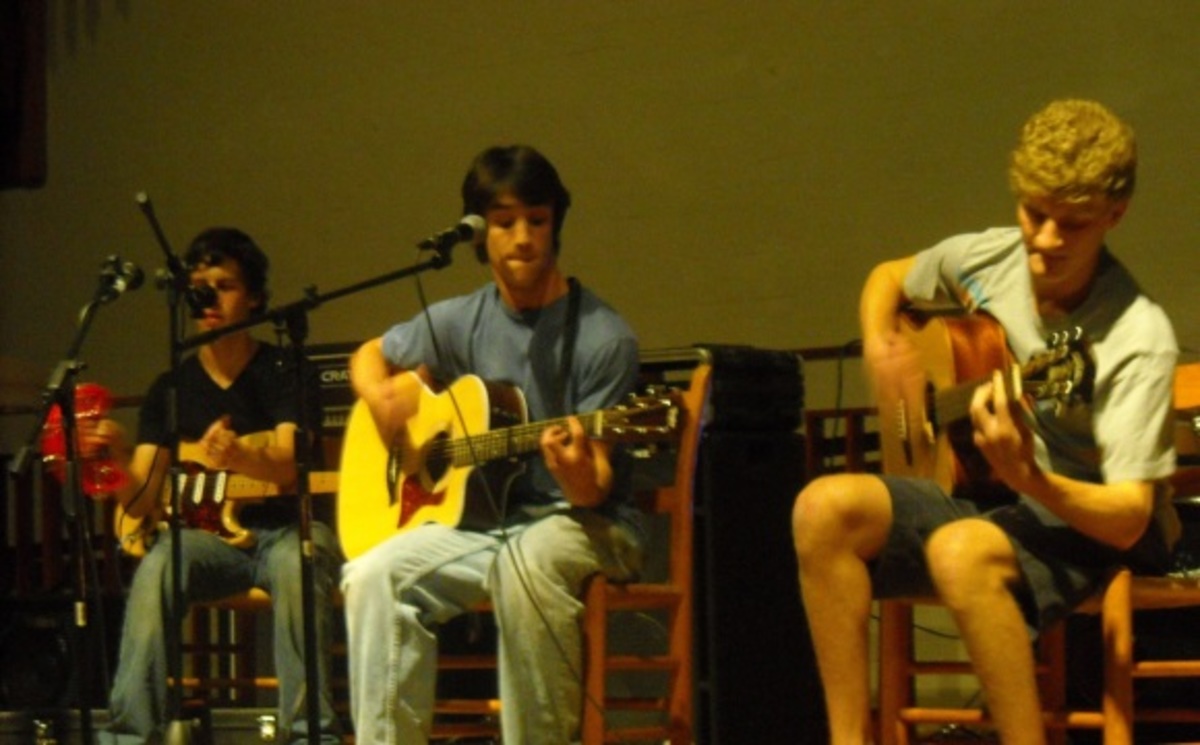 Of Cabbages and Kings energized the audience with their unusual cover of "Hey Ya." (From left: seniors Ian Arnold, Sammy Zeisel and David Garrison). Photo by Julia Dane.
