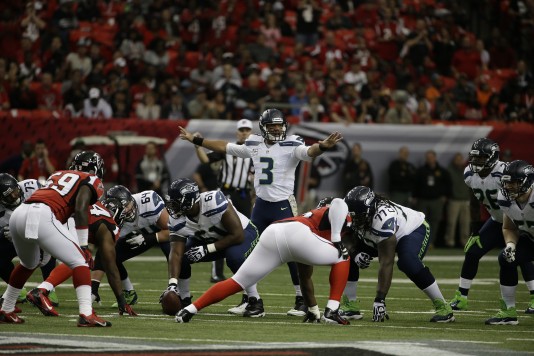 Seattle Seahawks quarterback Russell Wilson (3) changes a play at the line against the Atlanta Falcons during a Nov. 10 game. Russell has guided his team to a 9-1 record and has thrown 17 touchdowns compared to just six interceptions. (AP Photo/David Goldman)