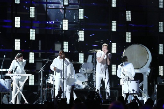 Kendrick Lamar, center left, and Dan Reynolds of Imagine Dragons, center right, perform at the 56th annual Grammy Awards at Staples Center on Sunday, Jan. 26, 2014, in Los Angeles. (Photo by Matt Sayles/Invision/AP)