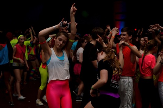 Students groove to the music, which played to an enthusiastic and large crowd for seven hours straight Saturday. Most donned rave-inspired neon or pastel colored outfits for the event, which raised over $27,000 for the Leukemia & Lymphoma Society. 