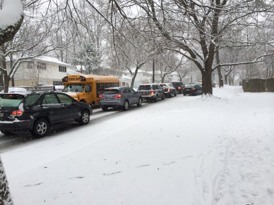 Cars sat in traffic on Whittier Blvd. this morning as snow fell, covering streets and causing many vehicles to spin out or lose control. Several other accidents on adjacent main roads caused many students and staff to arrive late to school. Photo by Ben Zimmermann.