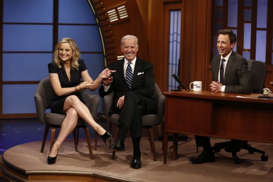 Actress Amy Poehler and Vice President Joe Biden appear with host Seth Meyers on the premiere of "Late Night with Seth Meyers" on Monday, Feb. 24, 2014, in New York. (AP Photo/NBC, Peter Kramer)