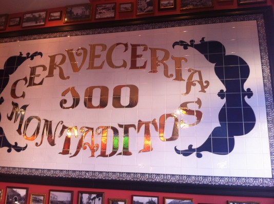 100 Montaditos on Elm Street greets customers with a warm, welcoming atmosphere, complete with pictures of Spain surrounding a tile sign. The food, however, falls short of great. Photo by Julia Maman.