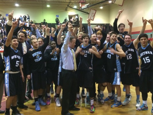 Coach Chris Lun and the Vikings celebrate the team's first regional championship since 2006. Photo by Ben Zimmermann.