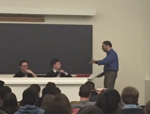 A judge delivers his decision during the final round at Harvard. The Arnesens defeated Dalton GF on a 4-1 decision. Photo by Ben Titlebaum.