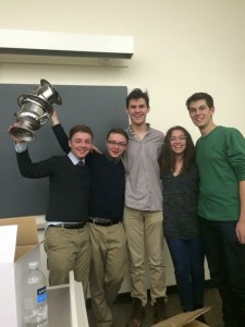 Juniors Sam and William Arnesen celebrate their victory with public forum coaches Fionn Adamian ('14), Rachel Baron ('13) and Nathaniel Schwamm. 345 other teams entered into the public forum tournament. Photo courtesy Hannah Chenok.