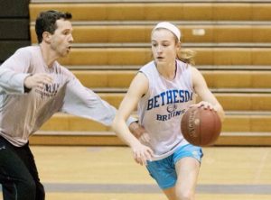 Sophomore guard Abby Meyers drives to basket against head coach Peter Kenah in a practice earlier this season. Both Meyers and Kenah received All-Gazette honors this past Wednesday. Photo courtesy The Gazette.