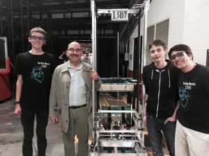 Members of the robotics team and an at-large member of the Montgomery County Council pose with the team's robot  after last week's competition. The team placed eighth out of 58 teams. Photo courtesy Ethan Putnam.