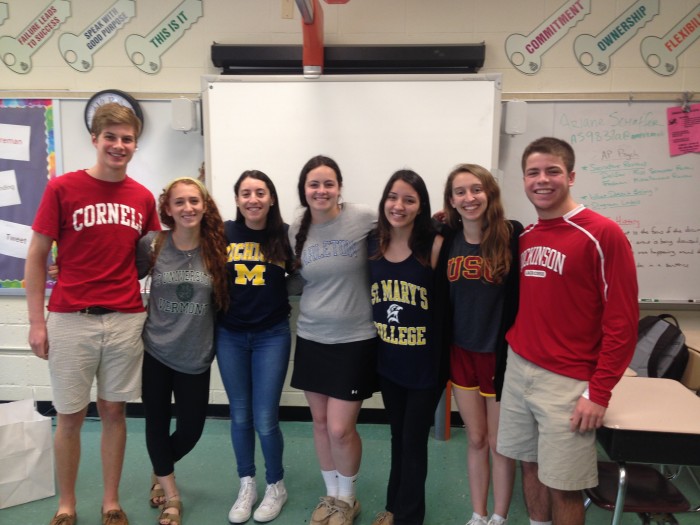 Seniors in the Leadership class show off their shirts on college t-shirt day. Photo by Rachel Hazan.