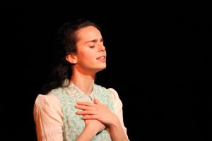 NYU graduate Arielle Goldman performs "To Life, L'Chaim!" The play, based entirely on Lowy's experiences in the Holocaust, was performed at CESJDS April 26. Photo courtesy David Stein.