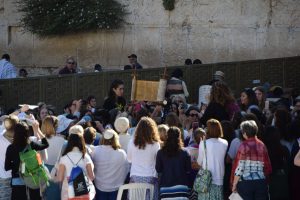 First photo from the email "Women of the Wall." Caption: The Women of the Wall celebrate their beliefs through praying with the Torah at the Western Wall. Photo by Matthew Hoffman.