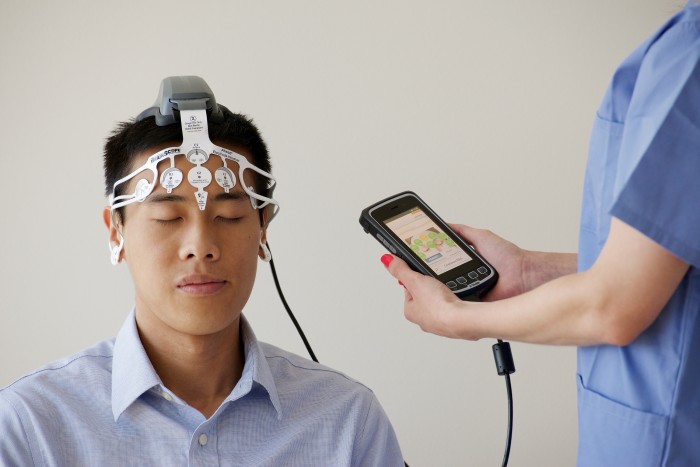 Patients test BrainScope's handheld device to evaluate its ability to quickly detect brain injuries. Students who are diagnosed with concussions may be eligible to participate in the study. Photo Courtesy of BrainScope Co. Inc.