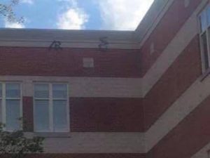  Symbols that were spray painted on to the roof this summer as part of the vandalism were visible from the courtyard, and have since been removed. Photo courtesy Cherisse Milliner.
