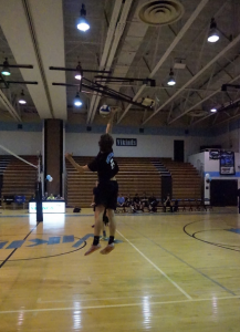 Outside hitter Stepan Casey goes up for a spike. Photo by Carolyn Price