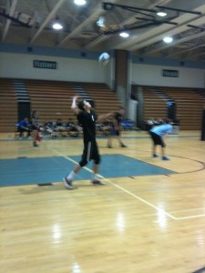 Outside hitter Colin Grant prepares to serve the ball in the Vikes' impressive showing against Churchill. Photo by Carolyn Price.
