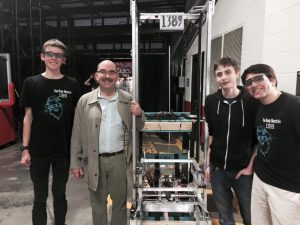 Members of the robotics team and an at-large member of the Montgomery County Council pose with the team's robot after last week's competition. The team placed eighth out of 58 teams. Photo courtesy Ethan Putnam.