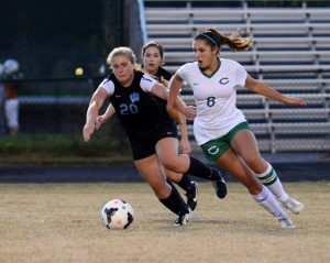 Defender Lindsay Wytkind fends off a Bulldog attacker in Monday's blowout loss to Churchill. Photo courtesy Buck Phillips.