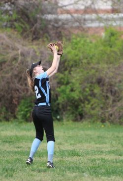 Outfielder Lauren Evoy chases down a fly ball. Photo by Olivia Matthews.
