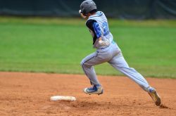 Outfielder Noah Clement legs out a triple against Northwood. Photo courtesy Whitman baseball.
