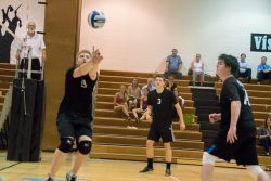 Setter Stefan Greenberg sets up a hit for his teammates in the team's last home game against Damascus. Photo courtesy Sean Lydon.