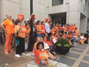 Moms Demand Action for Gun Sense in America rally in Arlington, listening to representatives speak about ways to get legislation passed to tighten gun laws. Photo by Sophia Knappertz.